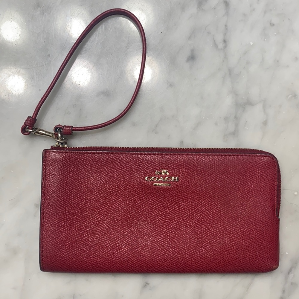 Women’s Maroon Coach wallet and wrist strap
